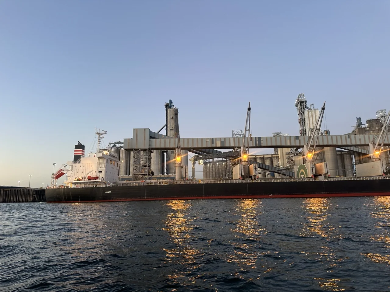 Bulk vessel, conveyors and loading infrastructure on the Columbia River, photographed by Andrew Rider